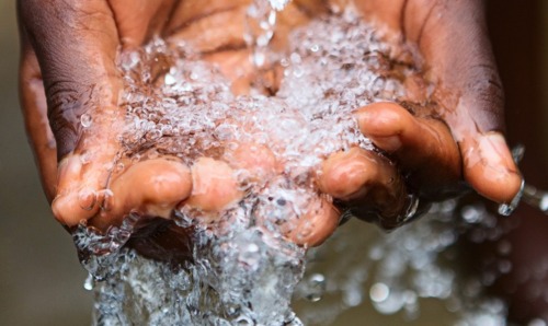 Water flowing over hands