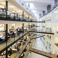 An open-plan co-working space with desks.