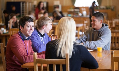 A group of residents sat in the Ashburne Hall dining room.