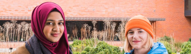 Two students facing the camera outside the Whitworth art gallery