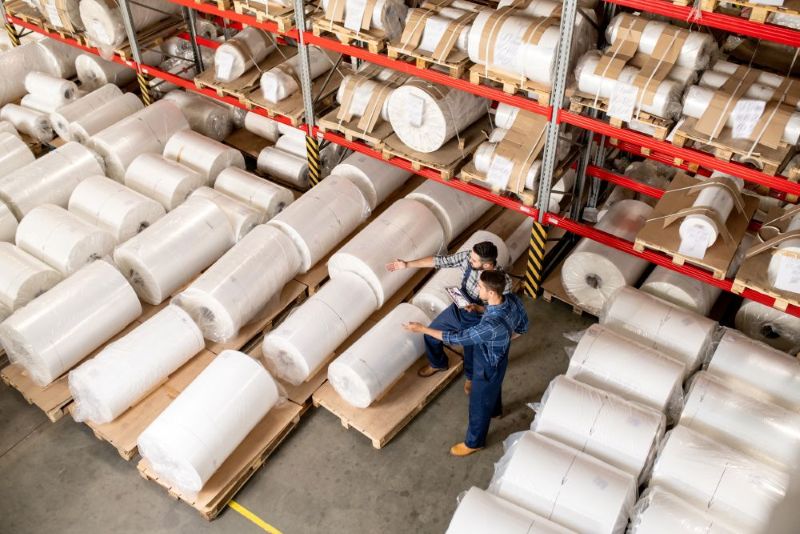 Warehouse workers with fabric