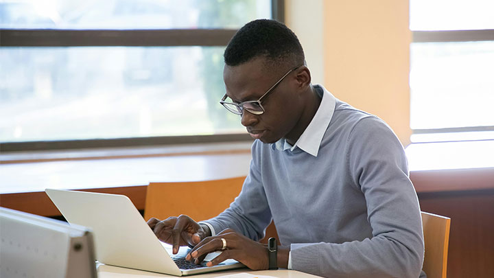 Man at a desk with laptop