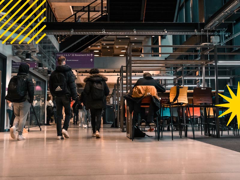 Students walking through a university building 