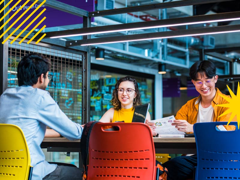 Students sat at a table studying