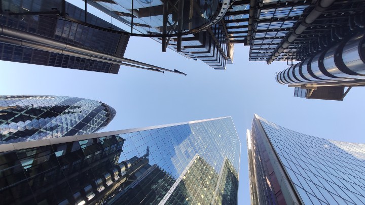 View from the ground looking up at multiple skyscrapers