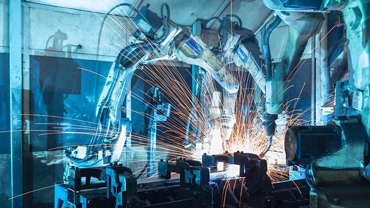 Welding robots in the automotive industry.