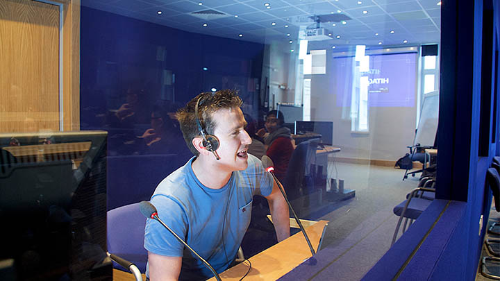 Male student using language lab