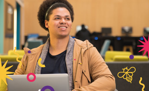 Student on laptop in University atrium