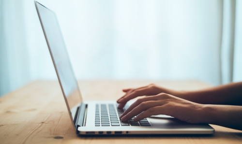 Hands typing on the laptop 