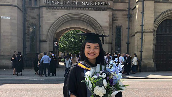 Amelia Huang's graduate photo outside Whitworth Hall.