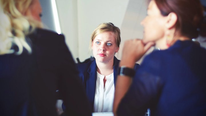 A woman sat in a meeting