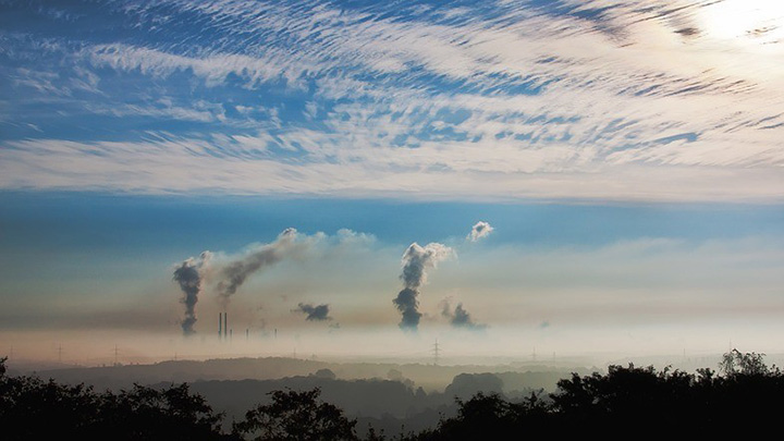 Skyline photo showing emissions from a power station