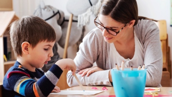 Educational psychologist working with young boy