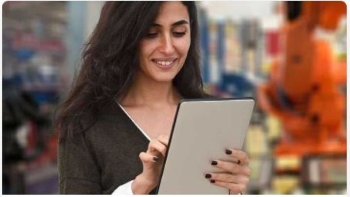 Female student with a handheld tablet