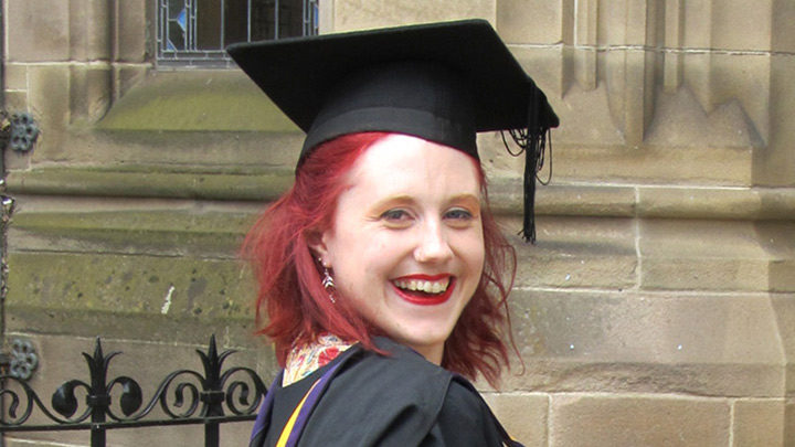 Picture of Rachel Cox in her graduation hat and gown