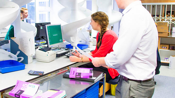 Two students using a computer in a laboratory.