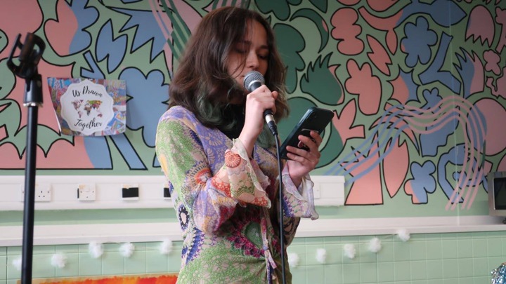 Miriam speaking at an event.