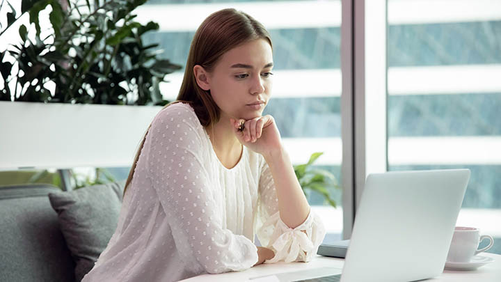 Student with a laptop working