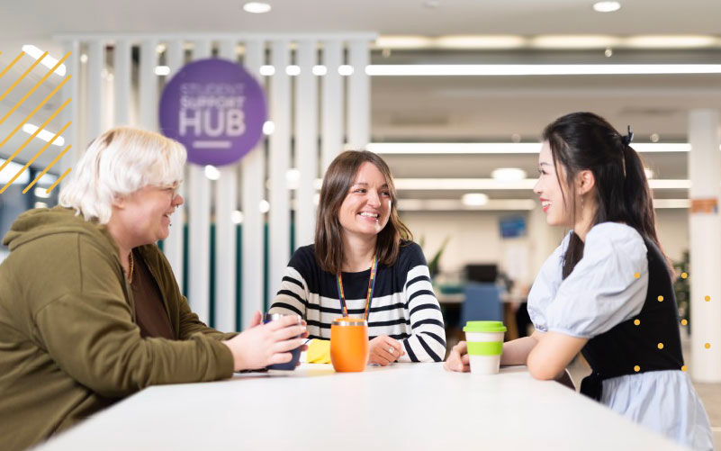 People sat chatting in a student hub