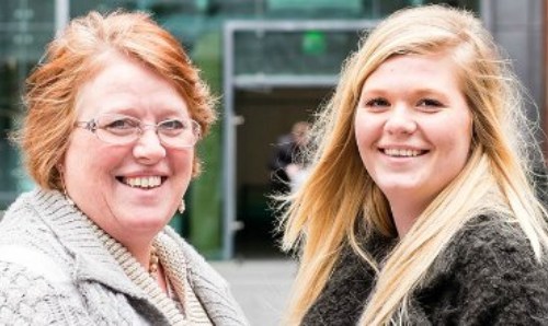 Parent and daughter taking a look around the university