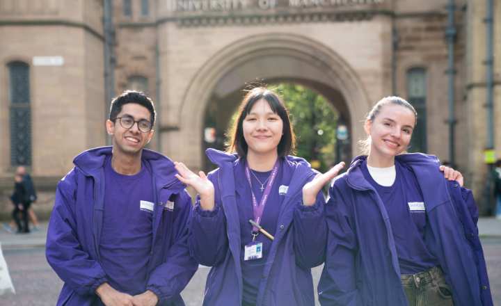 Three students in purple branded jackets